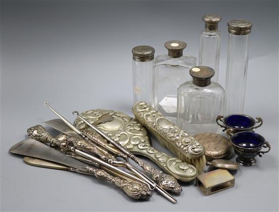 A mixed quantity of silver items including toilet jars, shoe horns, button hooks and two silver salts & a silver plated hand mirror.